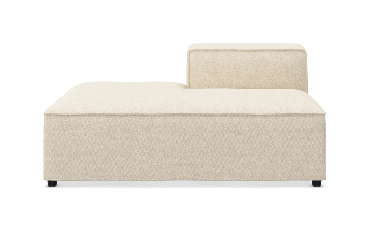 Beige modulsofa med lav ryg i højre side, frilagt forfra.