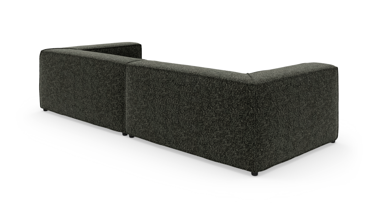 Modulsofa i mørkegrøn/grå tekstil, L‑form set bagfra på hvid baggrund.