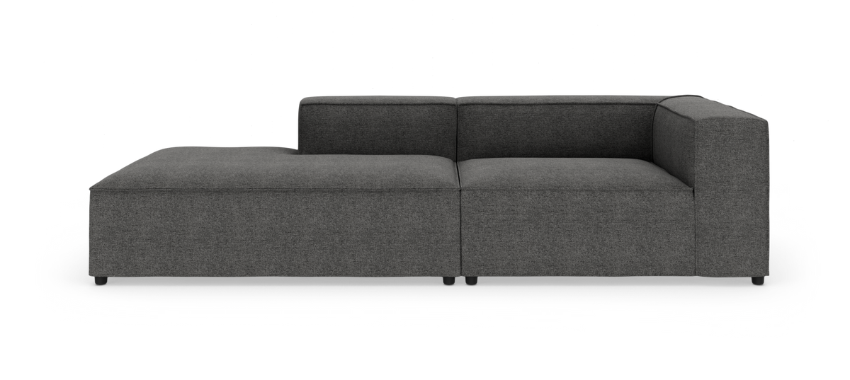 Mørkegrå modulsofa med venstrevendt chaiselong, set forfra.