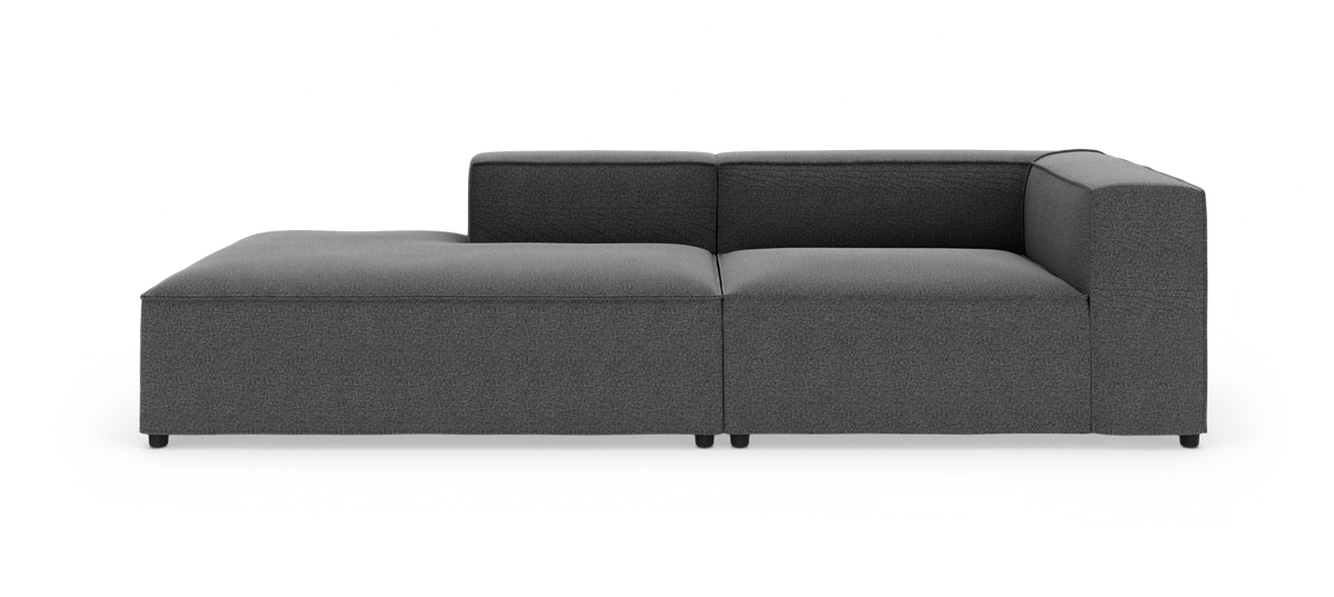 Mørkegrå modulsofa med venstrevendt chaiselong på hvid baggrund.