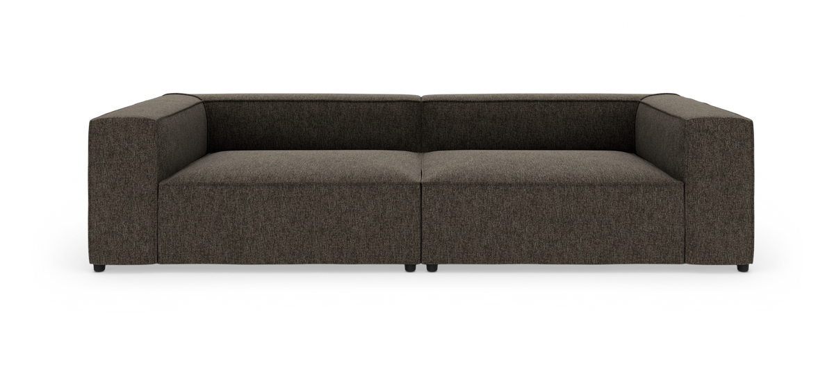 Mørkegrå modulsofa med brede, bokslignende armlæn, frilagt på hvid baggrund.