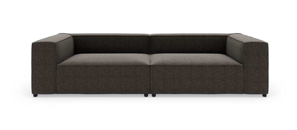 Mørkegrå, moderne modulsofa med brede armlæn, fritlagt på hvid baggrund, set direkte forfra.