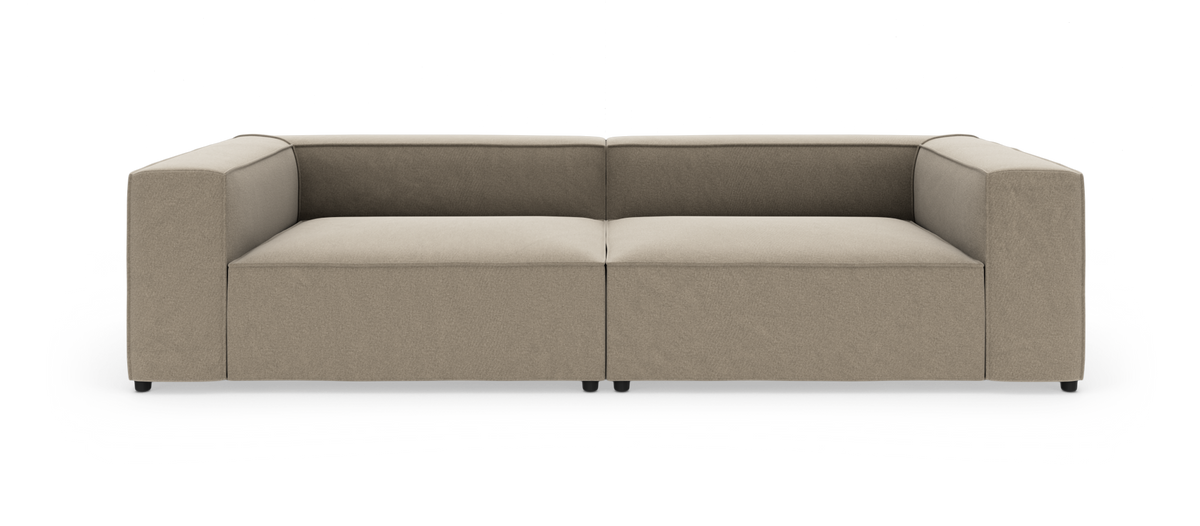 Beigefarvet, moderne modulsofa med brede armlæn, set lige forfra på hvid baggrund.