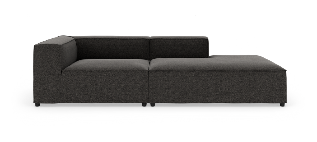 Mørkegrå modulsofa med højrevendt chaiselong på hvid baggrund.