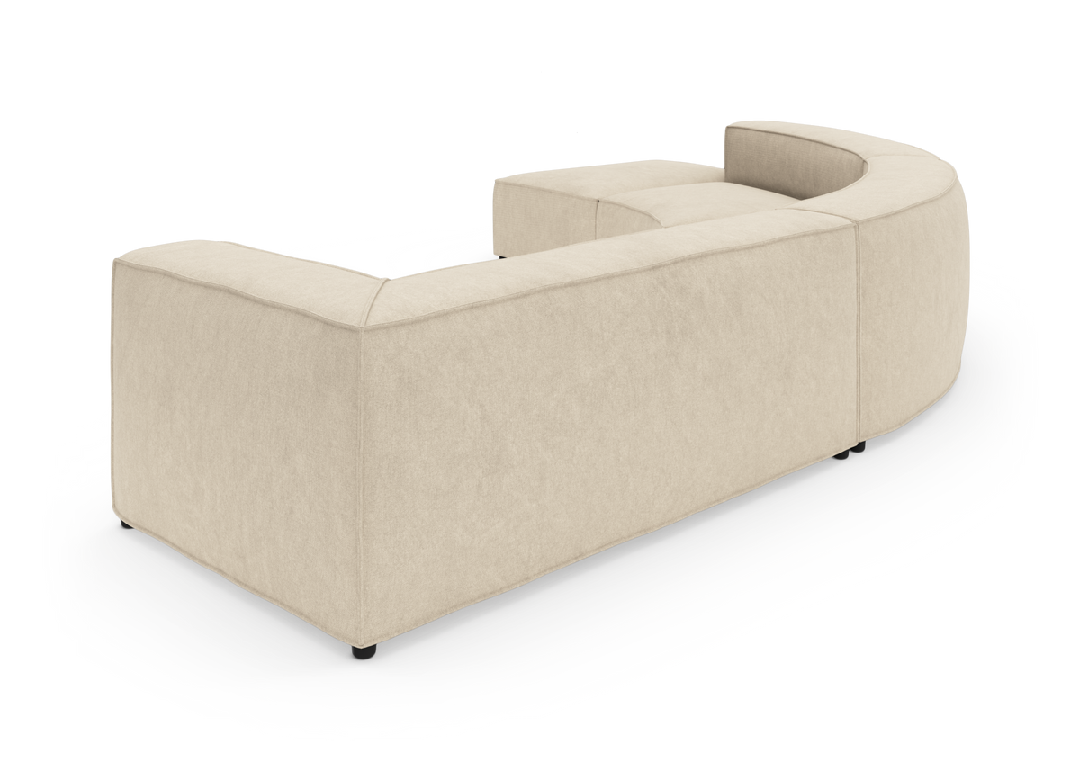 Beige modulsofa i buet U‑form, vist bagfra på hvid studiobaggrund.