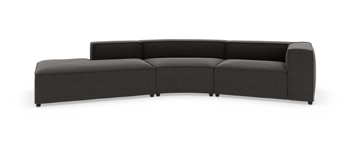 Mørkegrå modulær sofa med venstre chaiselong og let buet opstilling, frilagt på hvid baggrund.