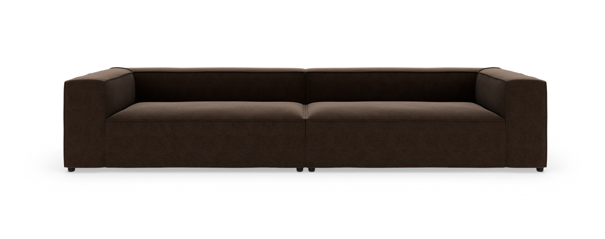 Mørkebrun, moderne modulsofa med rette armlæn set lige forfra på hvid baggrund.