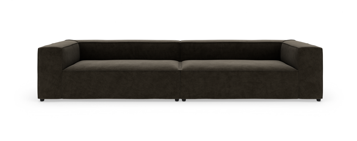 Mørkebrun modulsofa i moderne, lavrygget design set forfra på hvid baggrund.