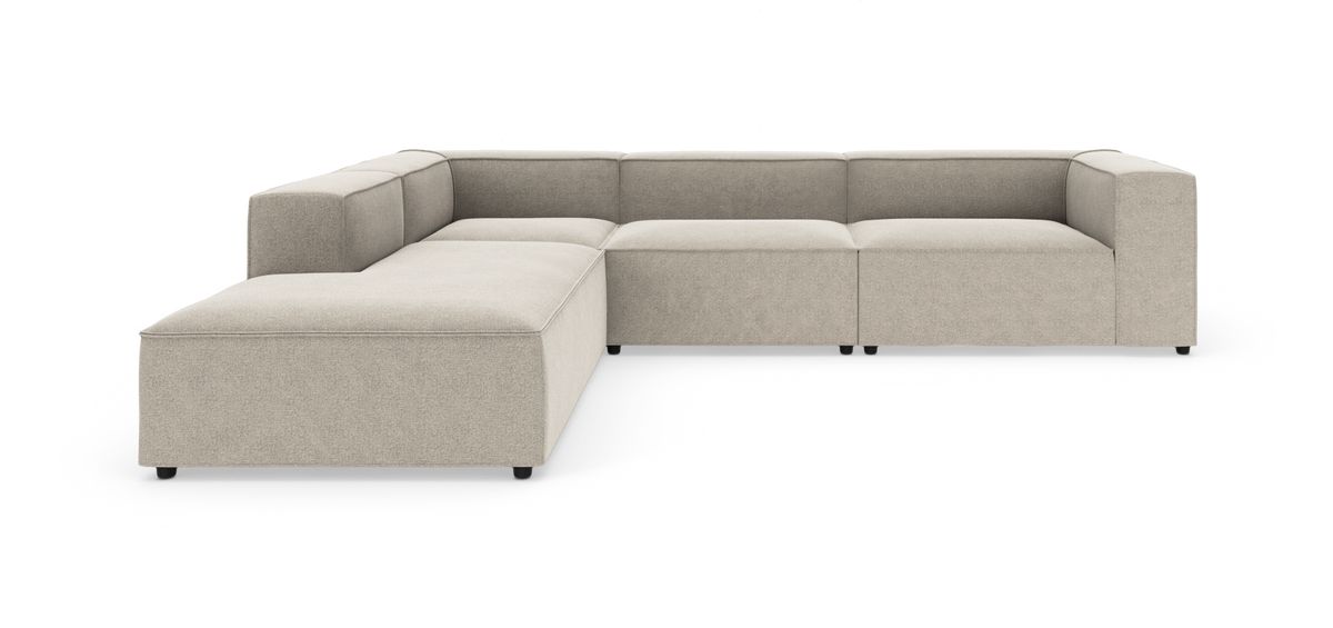 Beige modulsofa i U‑form på hvid baggrund.