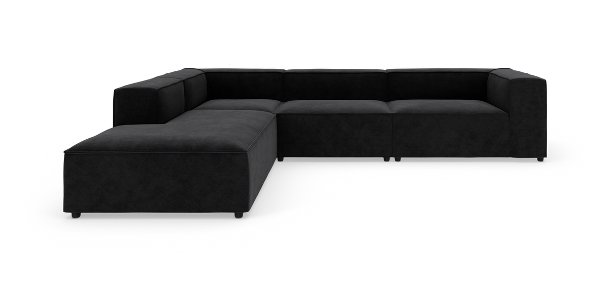 Sort modulsofa i L‑form på hvid baggrund, lav firkantet design med brede armlæn.