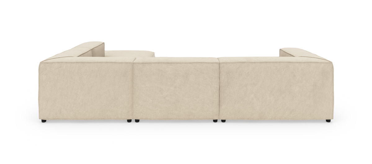 Beige modulsofa set bagfra på hvid baggrund.