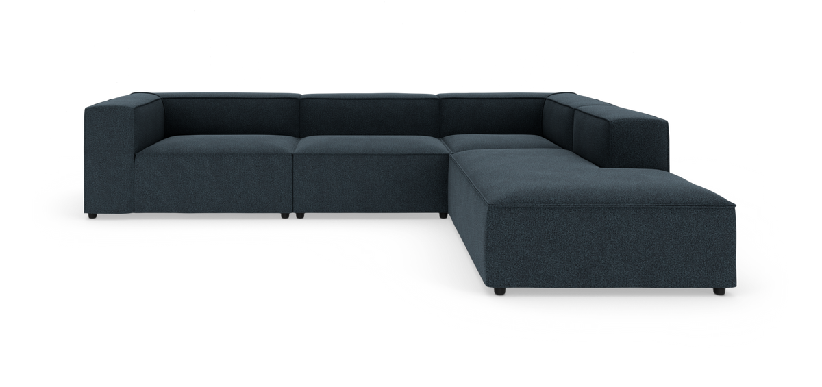 Mørkeblå L-formet modulsofa i moderne stil på hvid baggrund.