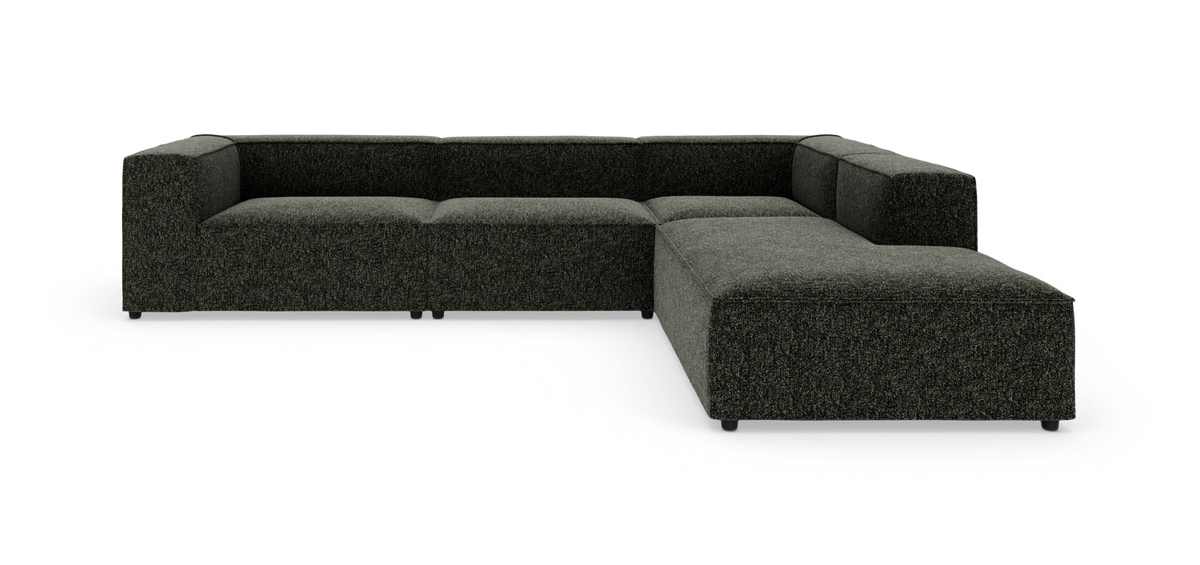 Mørkegrå L‑formet modulsofa i tekstil på hvid baggrund.