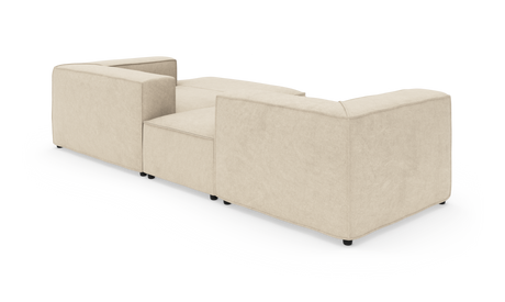 Beige L-formet modulsofa set bagfra i studie på hvid baggrund.