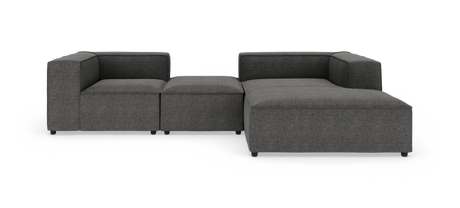 Modulsofa i mørkegråt stof med venstrehjørne, midterpuf og højre chaiselong, frilagt på hvid baggrund.