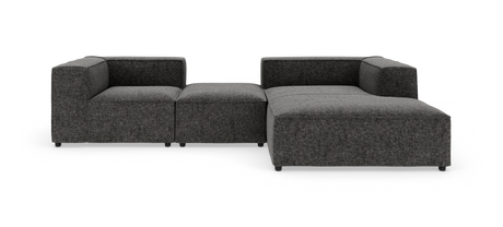 Modulsofa i mørkegråt stof i L‑form, frilagt på hvid baggrund.