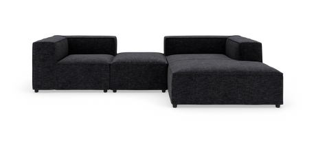 Modulær mørkegrå hjørnesofa i tekstil, vist på hvid studiebaggrund.