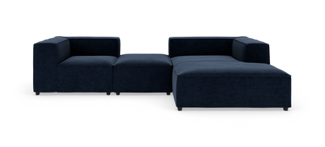 Modulær mørkeblå hjørnesofa med chaiselong på højre side mod hvid baggrund.