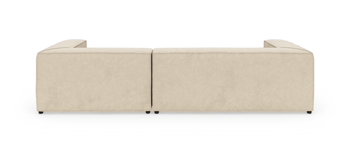 Beige modulsofa set bagfra mod hvid studiobaggrund.