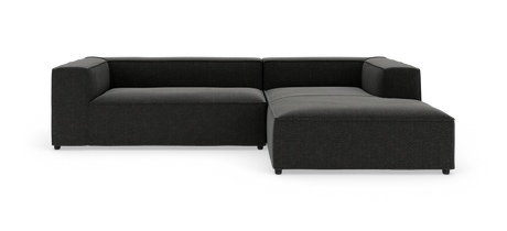 Mørkegrå modulsofa i L‑form med chaiselong til højre på hvid baggrund.