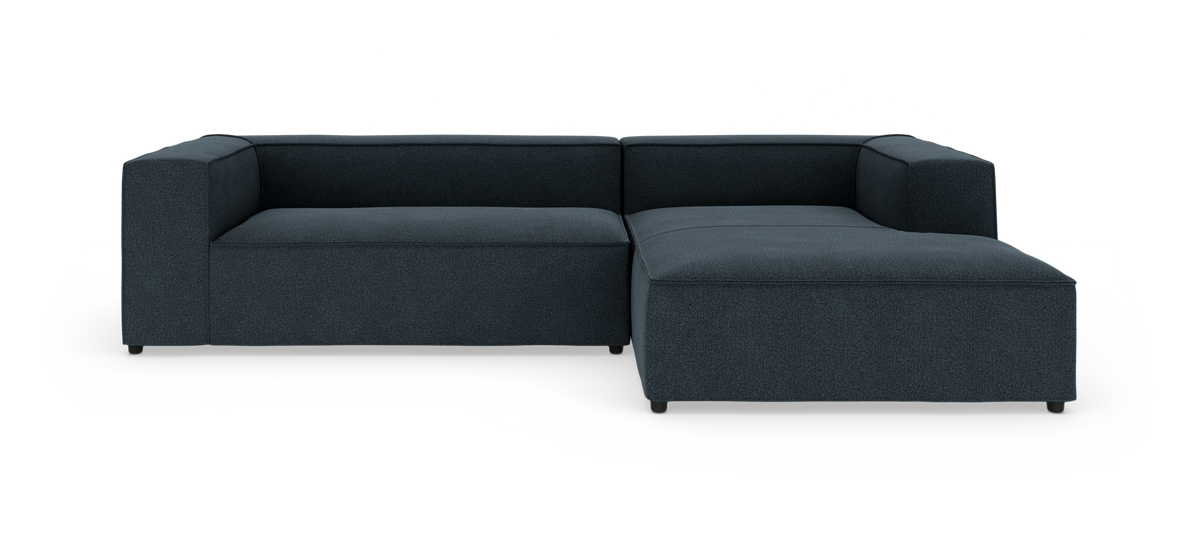 Mørkeblå, L-formet modulsofa med højrevendt chaiselong i moderne, minimalistisk stil.