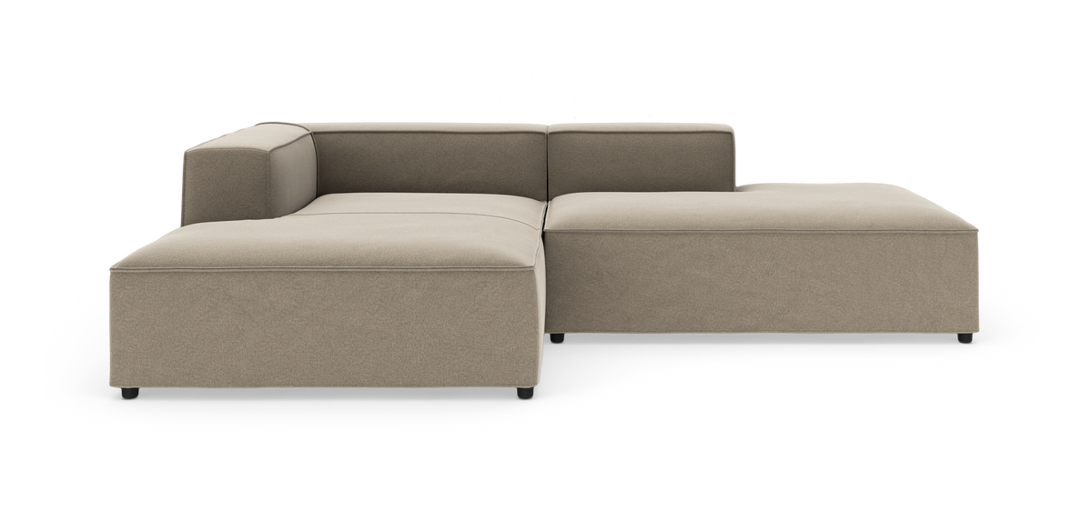 Beige modulsofa i L‑form på hvid baggrund.
