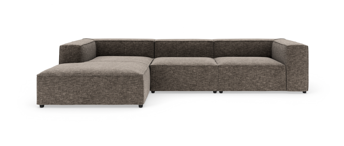 Modulsofa i L‑form med venstrevendt chaiselong i grå‑beige stof, frilagt på hvid baggrund.