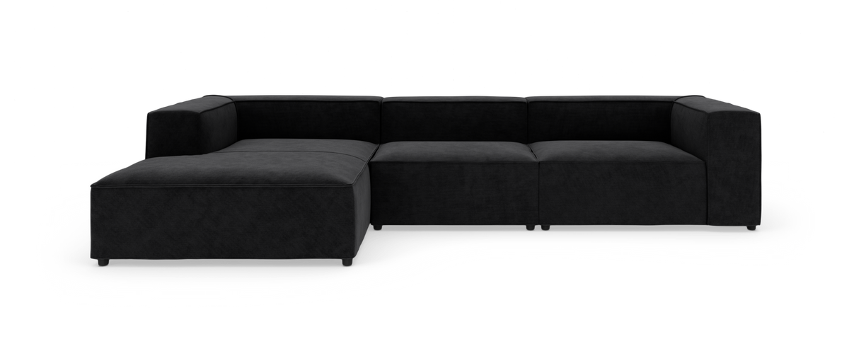 Modulsofa i sort stof med venstrevendt chaiselong, produktfoto på hvid baggrund.