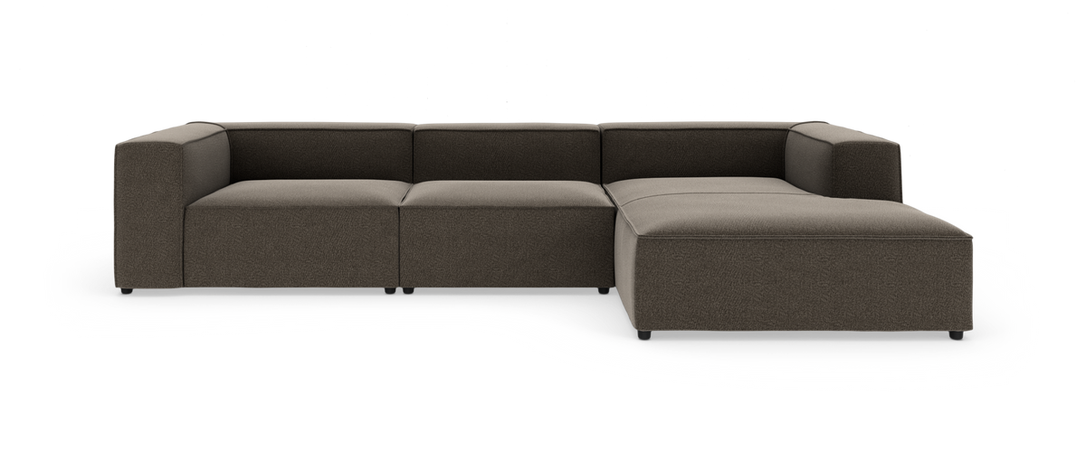 Modulopbygget hjørnesofa med chaiselong i mørkgrå/taupe stof på hvid studiobaggrund.