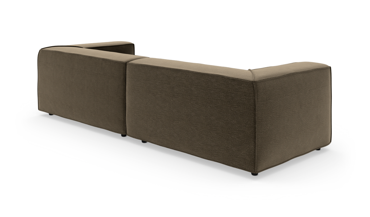 Brun modulsofa i stof set bagfra på hvid baggrund, L‑form.
