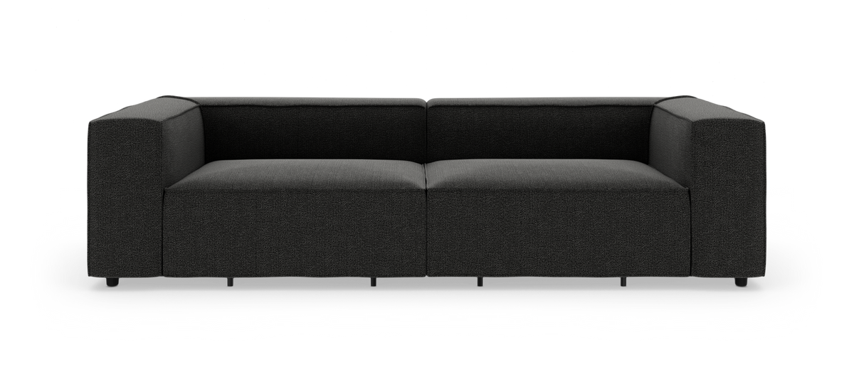 Sort, moderne modulsofa med brede armlæn, fotograferet lige forfra på hvid baggrund.
