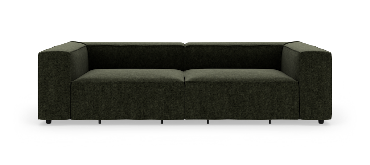 Mørkegrøn modulsofa med lav ryg og brede armlæn, frontvisning på hvid baggrund.