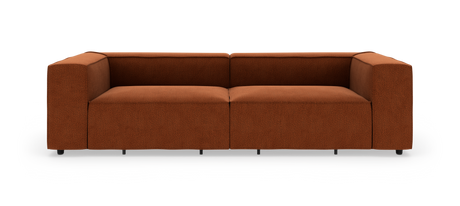 Modulsofa i rust-rød tekstil med brede, boksede armlæn, frilagt på hvid baggrund.
