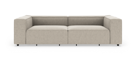 Beige, moderne modulsofa med brede armlæn, frilagt mod hvid baggrund.