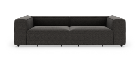 Mørkegrå moderne lav modulsofa med brede armlæn og dybt sæde, frilagt på hvid baggrund, set lige forfra.