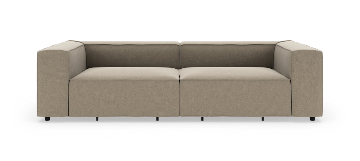 Beigefarvet, moderne modulsofa med stramme linjer, fritstående på hvid baggrund.