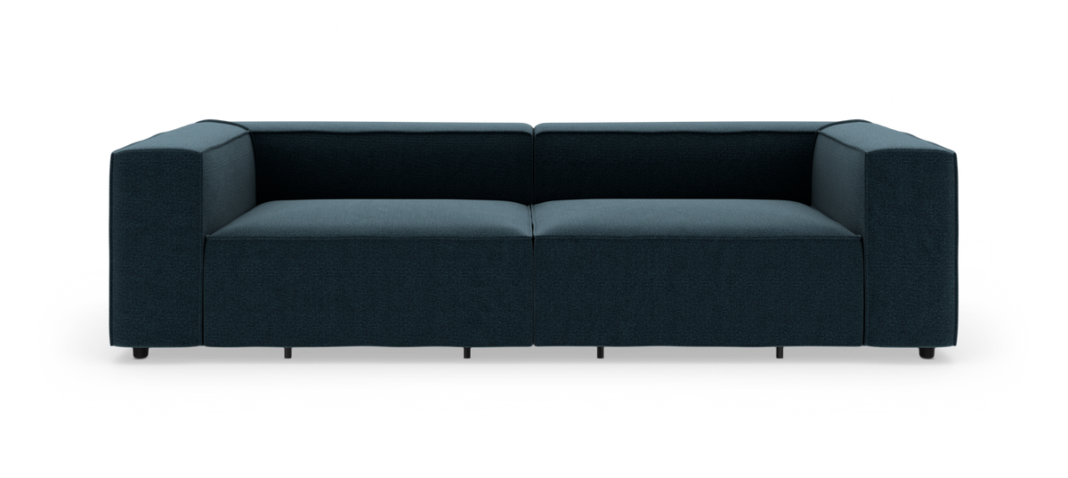 Mørk turkis, moderne 2-personers modulsofa med brede armlæn, fotograferet lige forfra mod hvid studiebaggrund.