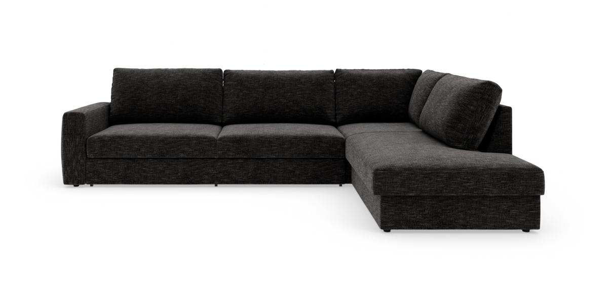 Mørkegrå L-formet hjørnesofa med chaiselong til højre på hvid baggrund.