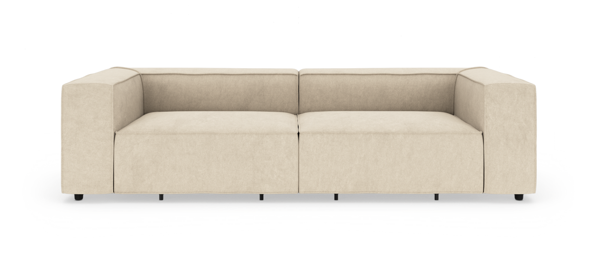Beige modulsofa med brede armlæn og to sæder, frilagt på hvid baggrund.