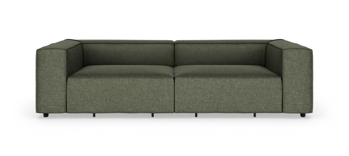 Grøn moderne 2-personers modulsofa med brede armlæn, frilagt på hvid baggrund.