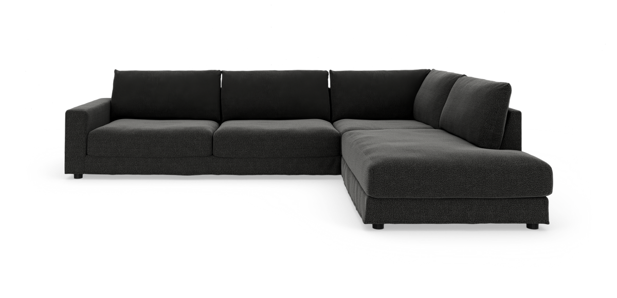 Mørkegrå L‑formet modulsofa med chaiselong til højre på hvid baggrund.