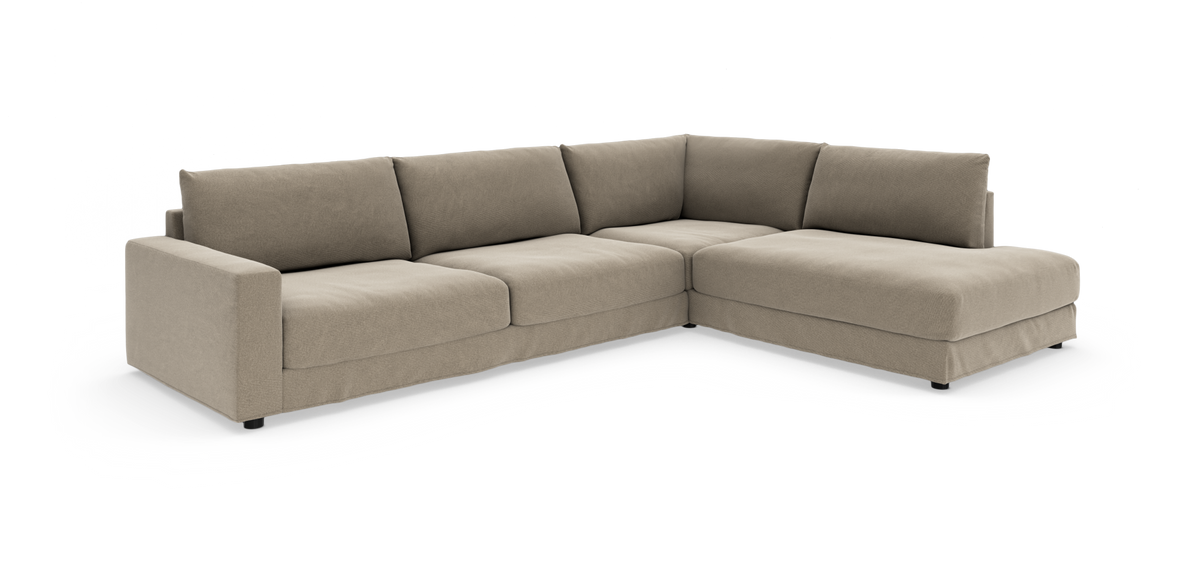 Beige modulær L-formet hjørnesofa med bløde hynder på hvid baggrund.