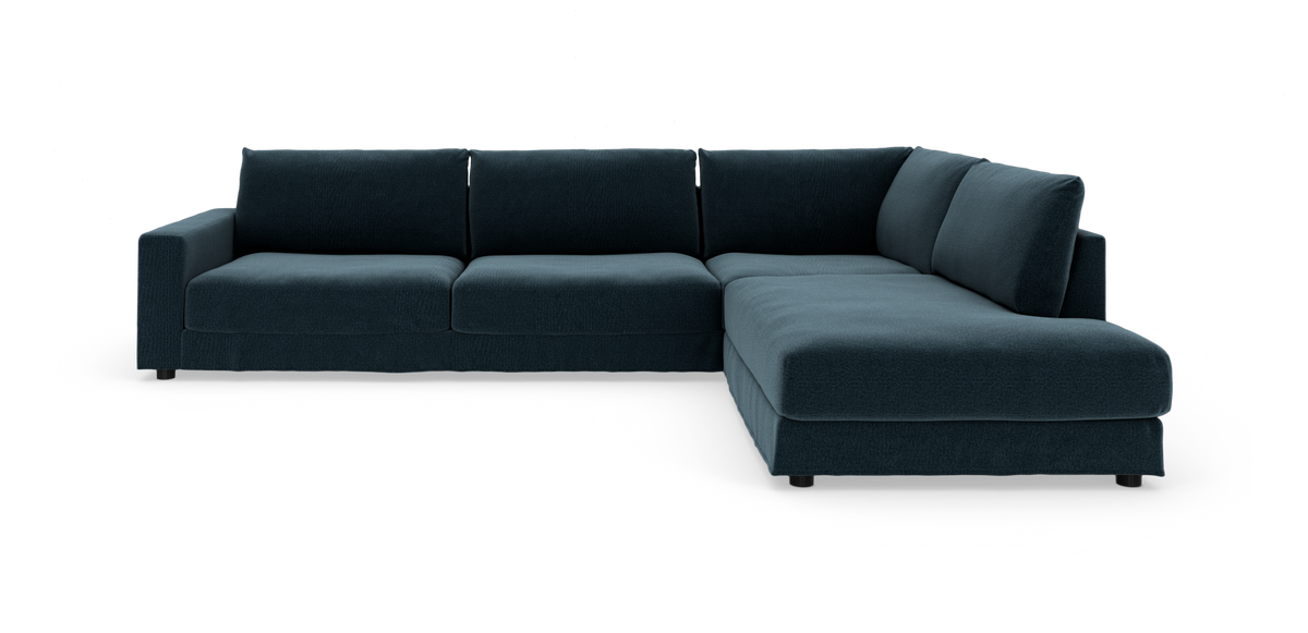 Mørkeblå L‑formet modulsofa med højrevendt chaiselong på hvid baggrund.