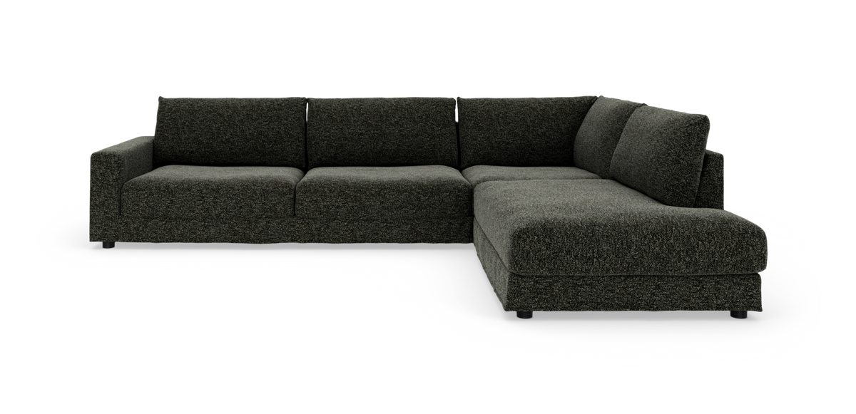 Mørkegrå L-formet modulsofa med chaiselong i højre side.