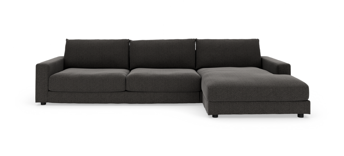 Mørkegrå modulsofa med chaiselong højre på hvid baggrund.