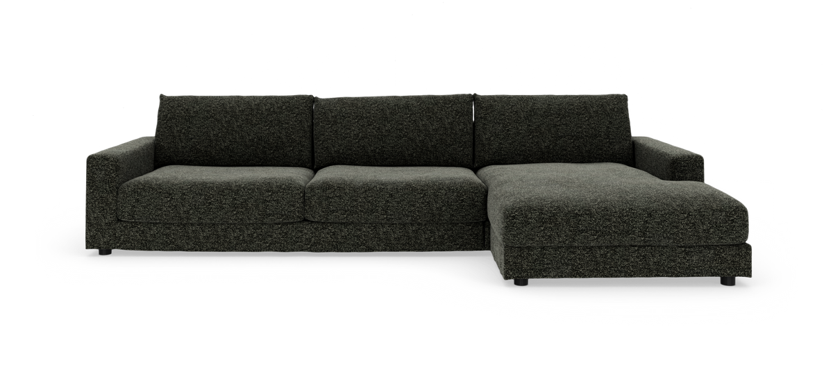 Mørkegrå modulsofa med højrevendt chaiselong, frilagt på hvid baggrund.