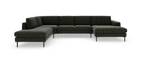 Mørkegrå U‑formet modulsofa med chaiselong til højre og slanke metalben, frilagt på hvid baggrund.