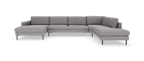 Grå modulsofa i U‑form med chaiselong, fritstående på hvid baggrund.