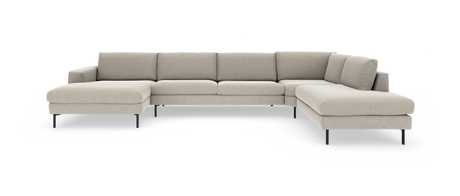 Beige U‑formet modulsofa med slanke sorte ben på hvid baggrund.