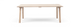 Rektangulært spisebord i lys eg med slanke skråtstillede ben, frontvisning på hvid baggrund.